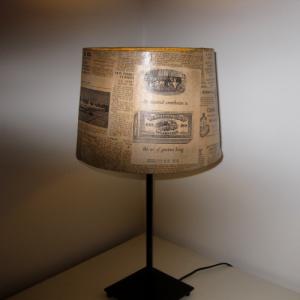 Retro decoupage lampshade dressed in vintage Financial Time newspaper from the 50s